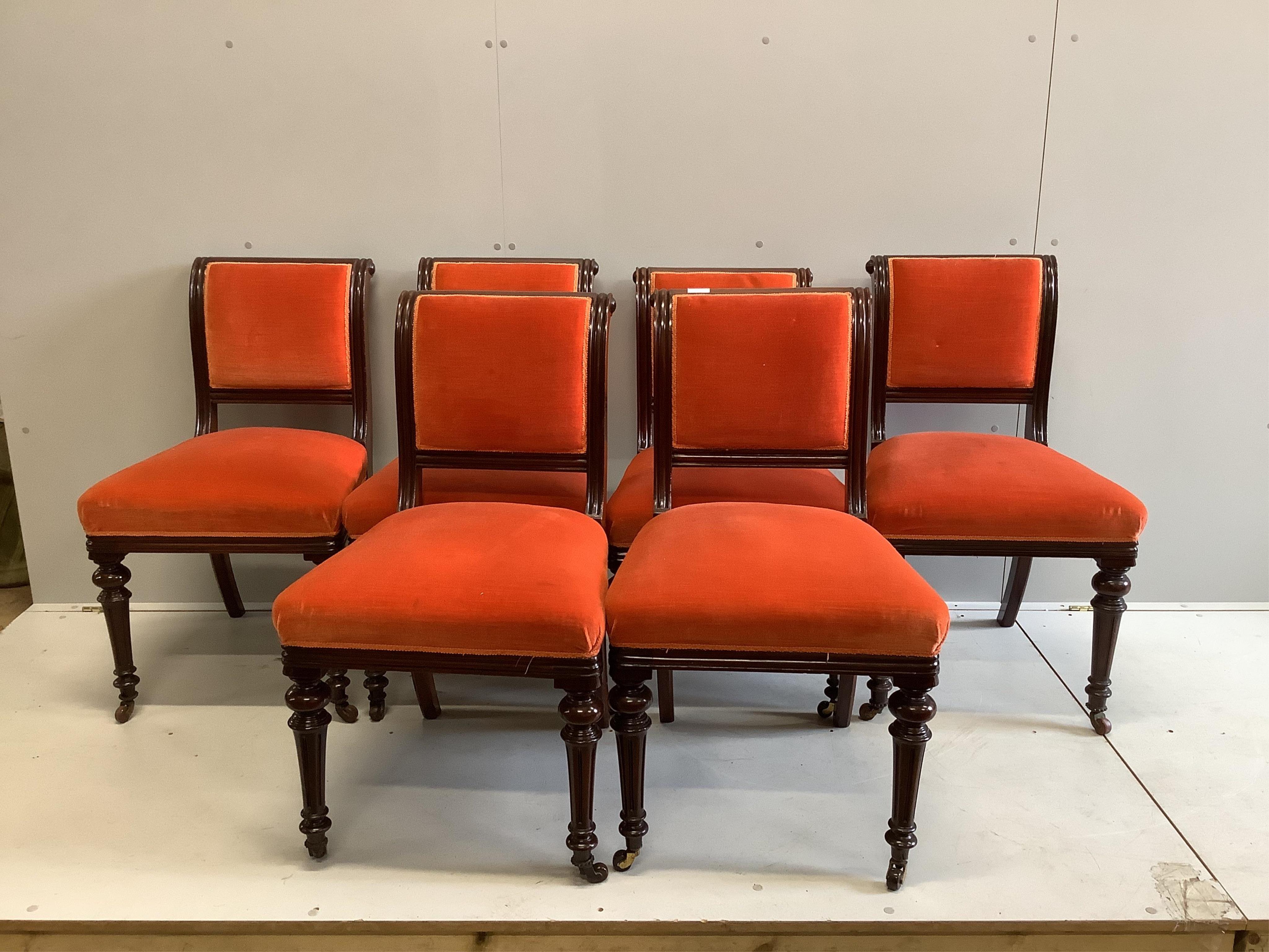 A set of six late Victorian upholstered mahogany dining chairs. Condition - good